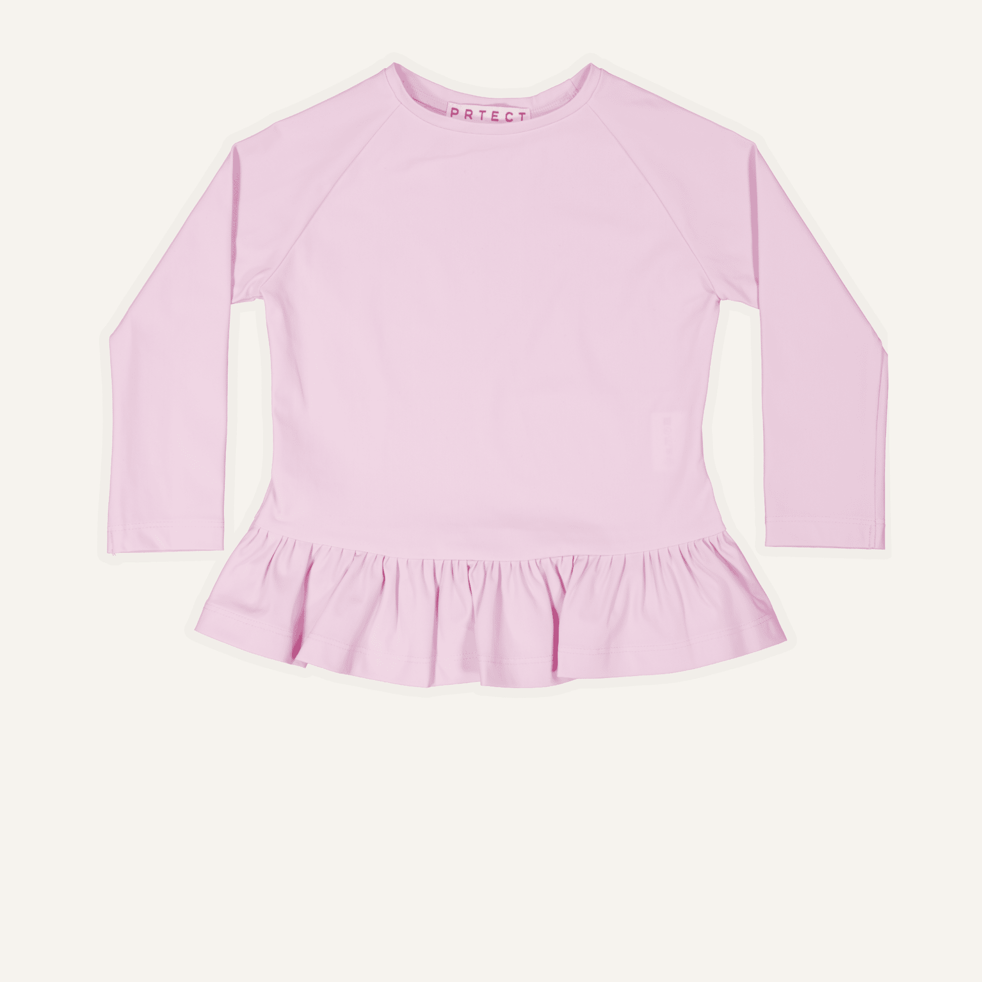 Childrens-Pink long-sleeve uk top with ruffled bottom on a white background