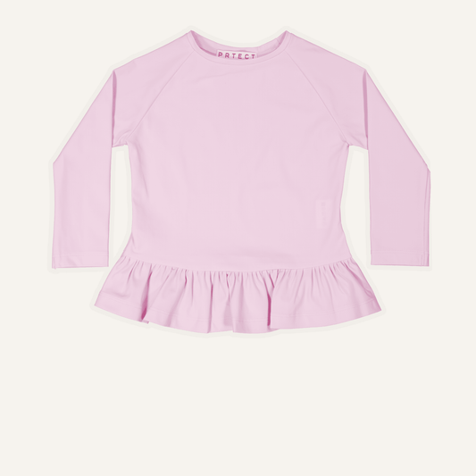 Childrens-Pink long-sleeve uk top with ruffled bottom on a white background